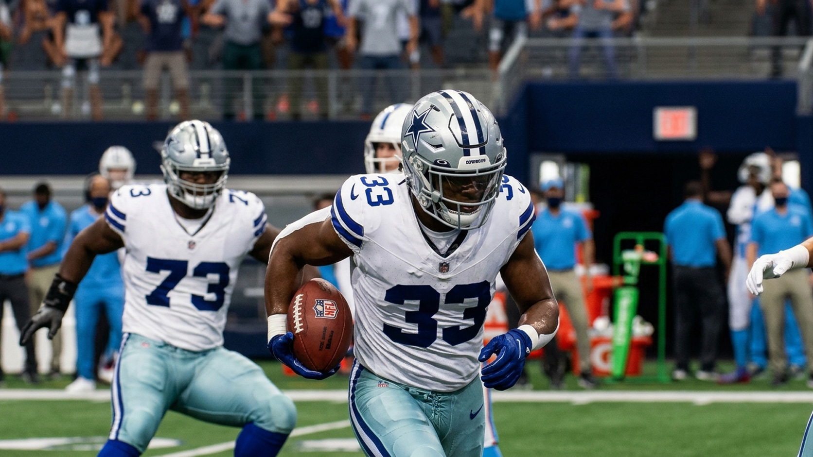 Javonte Williams rushing with the ball from the Dallas Cowboys vs. Tennessee Titans Week 11 game.